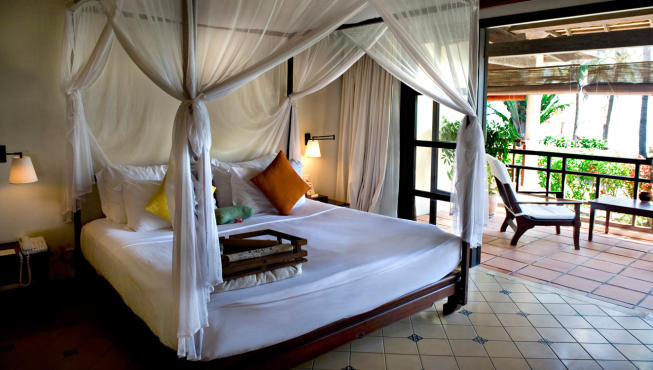 酒店客房，东南亚风格的装饰，简洁的布局，让旅途疲惫的人渐渐放松紧张疲累的身心。